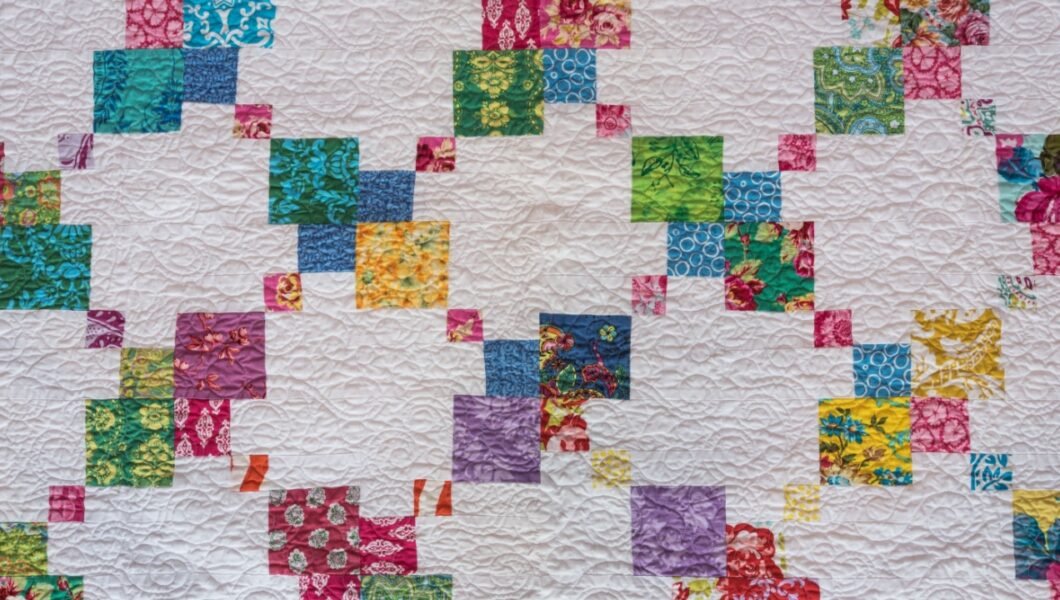Criss Cross of Color on White Background on Homemade Quilt