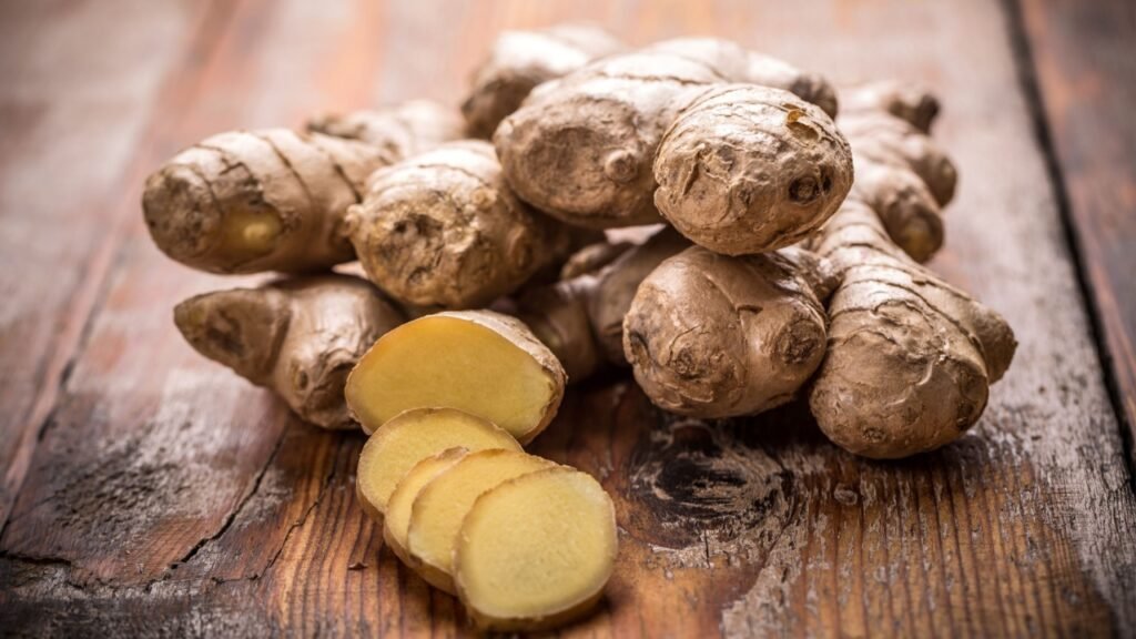 Fresh ginger root on wooden table