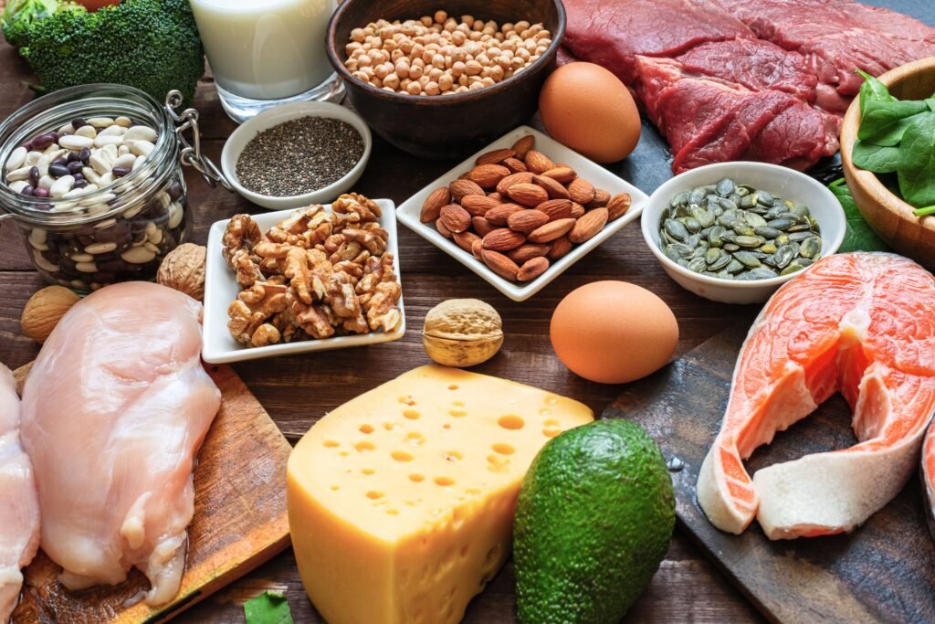 High vegetable and animal protein food sources. Fish, meat, poultry, nuts, cheese, eggs, seeds, vegetables and milk. Healthy eating and balanced food concept. Keto and low carb diet