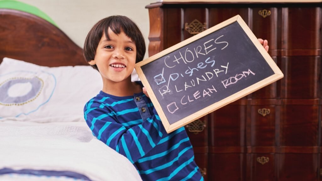 Portrait, chalkboard for chores and boy child in bedroom of home with checklist of housework responsibility