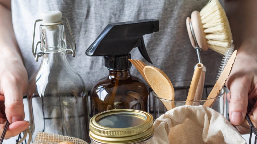 woman holding homemade cleaning products