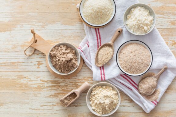 Assortment of various gluten free flour, without carbohydrate (almond and coconut flour, psyllium husk powder, rough-ground flaxseed flour)
