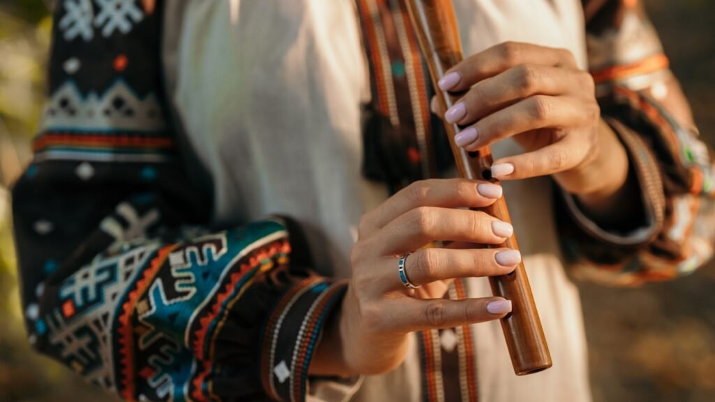 Hand Of Woman Playing On Woodwind Flute