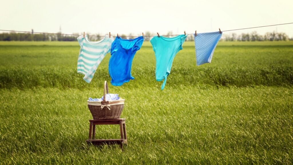 Laundry line with clothes in field