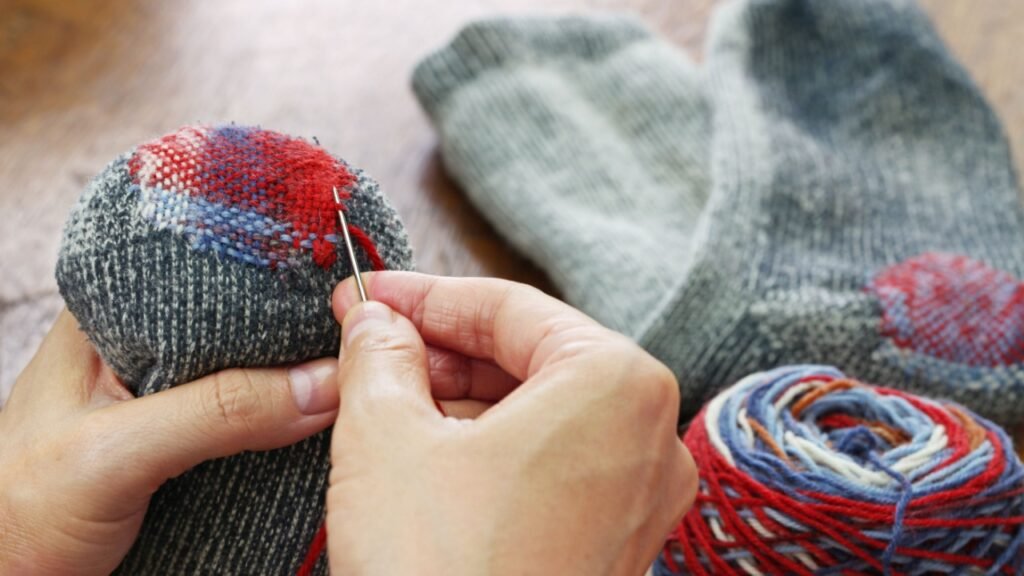 darning socks, repairing holes in socks