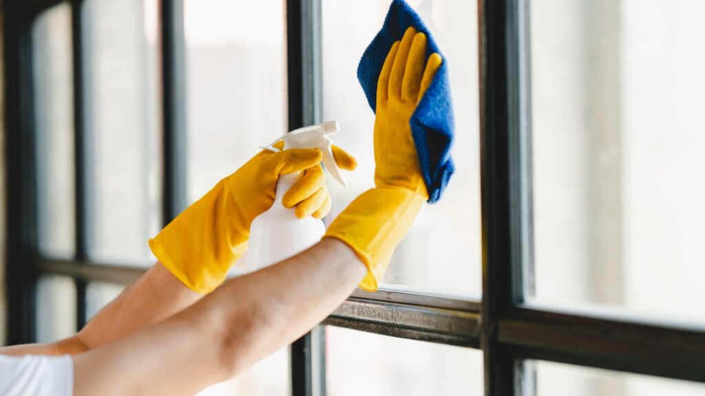 people doing cleaning are using cloths and spraying disinfectant Wipe the glass in the office room.
cleaning staff
cleaning maid